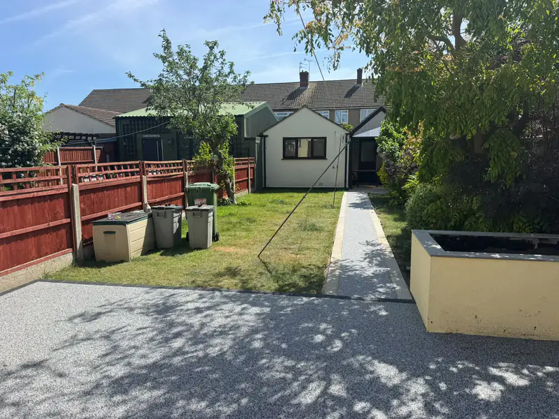 Resin bound patio and path running the length of a back garden