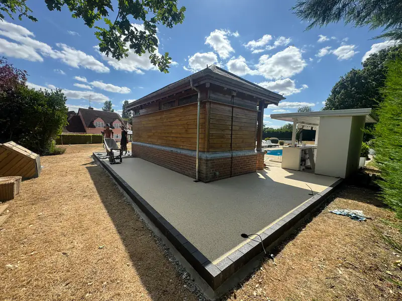 Resin bound surface laid around a garden building