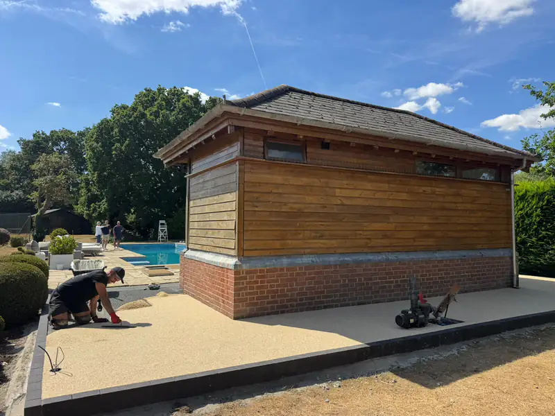 Laying a resin bound surface around a garden building