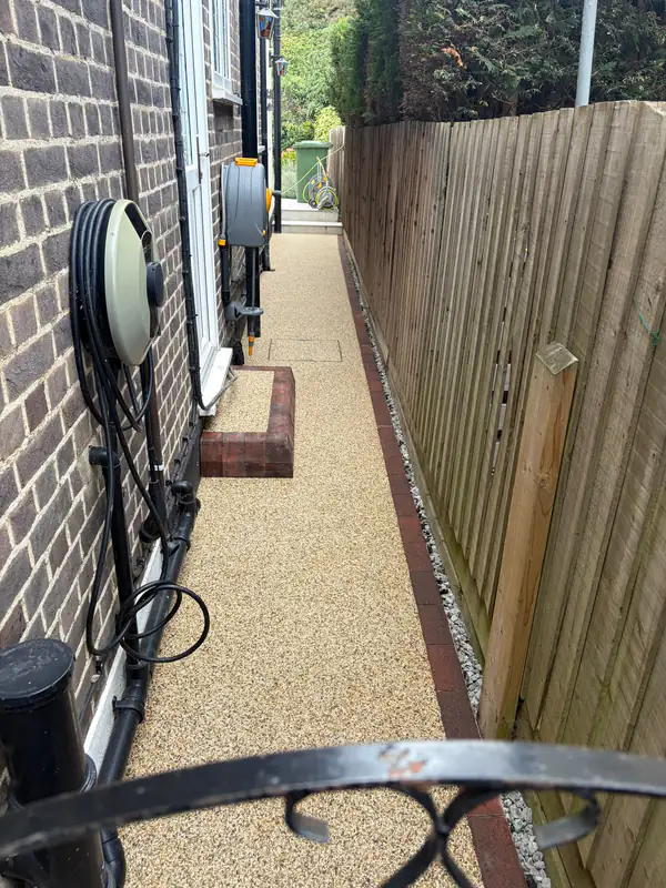 Resin bound path along a narrow side passage