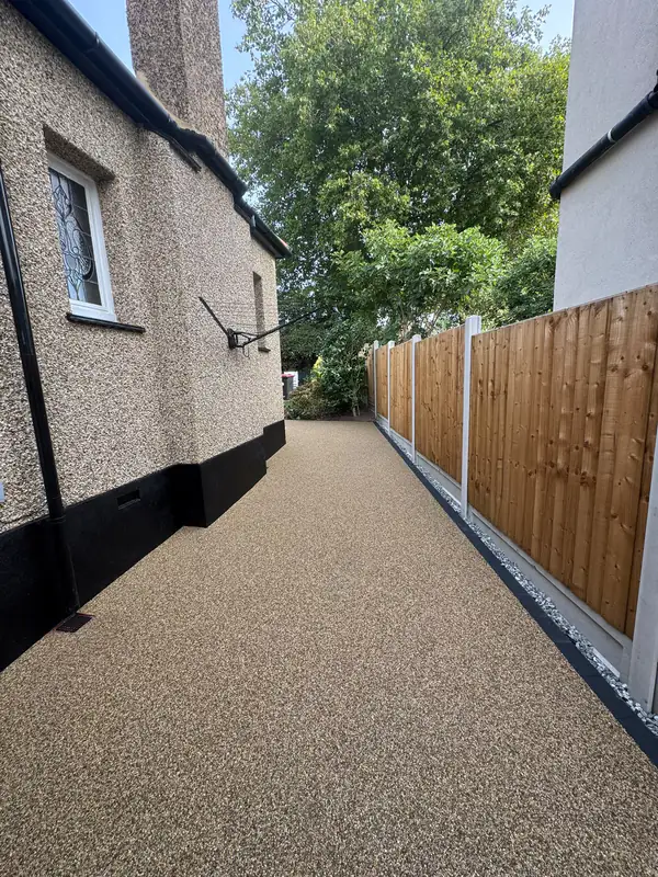 Resin bound side path between a house and a fence