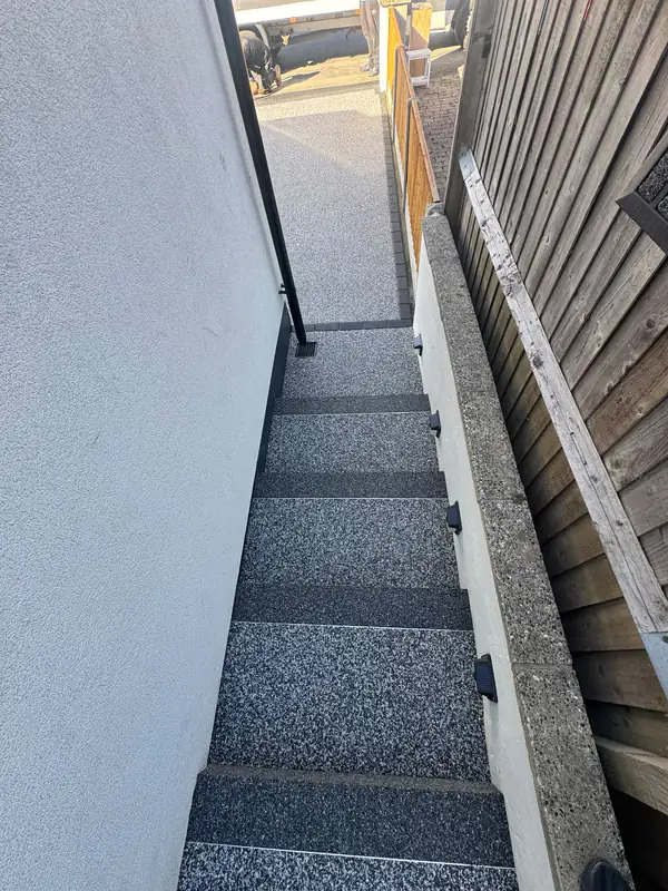Resin bound steps climbing a narrow side passage