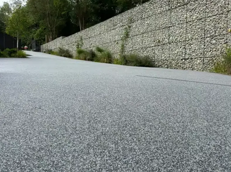 kent resin driveways grey resin closeup gabion wall