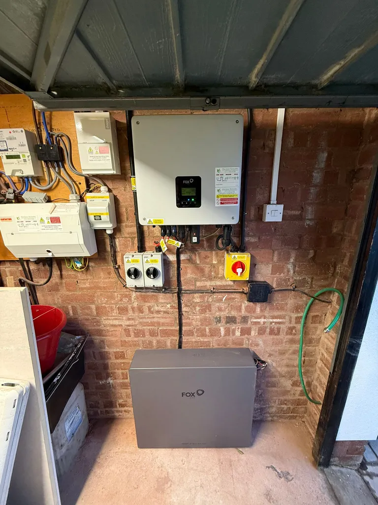 Fox ESS ECS hybrid inverter and battery storage installed in garage — Manchester Renewables