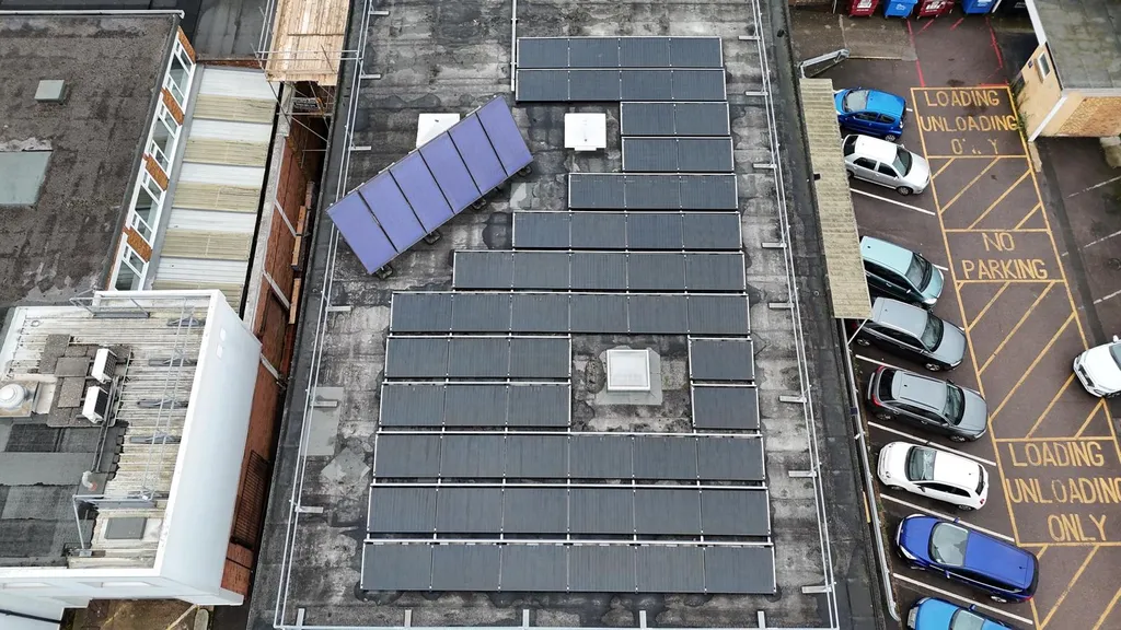 Commercial building solar PV with car park — aerial view, Manchester