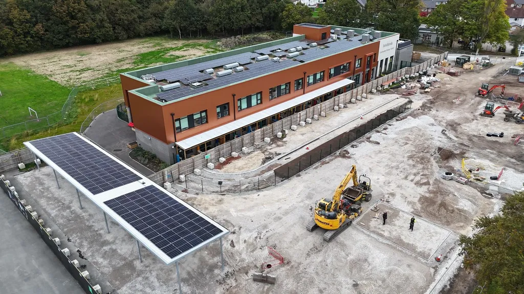 Commercial solar installation on primary school — aerial, Manchester