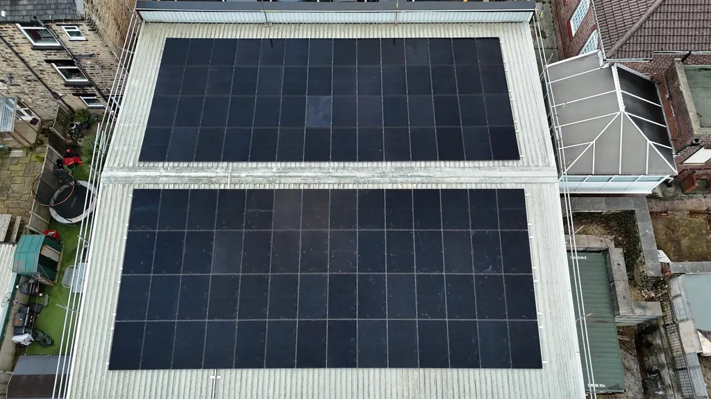Commercial solar panel array — maximum roof coverage, Manchester