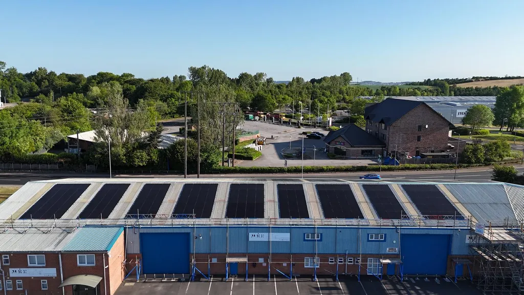 Commercial solar panel installation on industrial unit — front view, Manchester