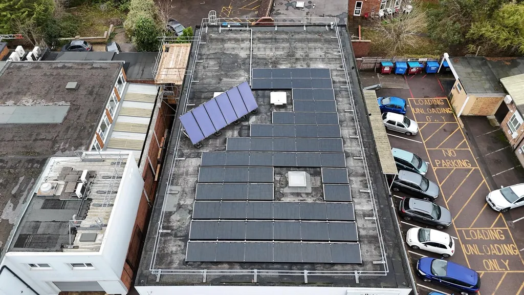 Commercial solar panels with full roof coverage in urban Manchester