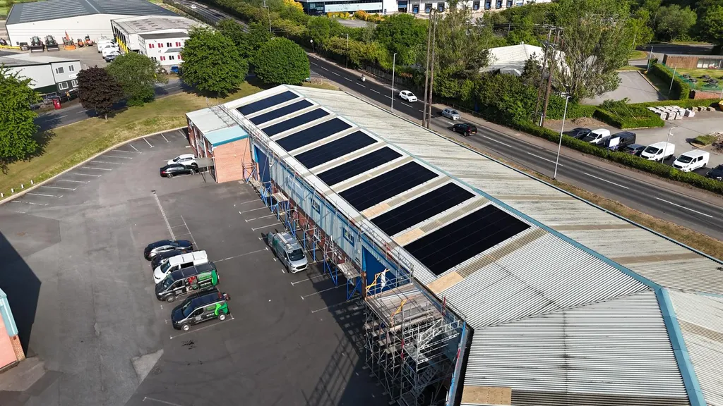 Commercial solar panels on pitched roof — industrial estate, Manchester