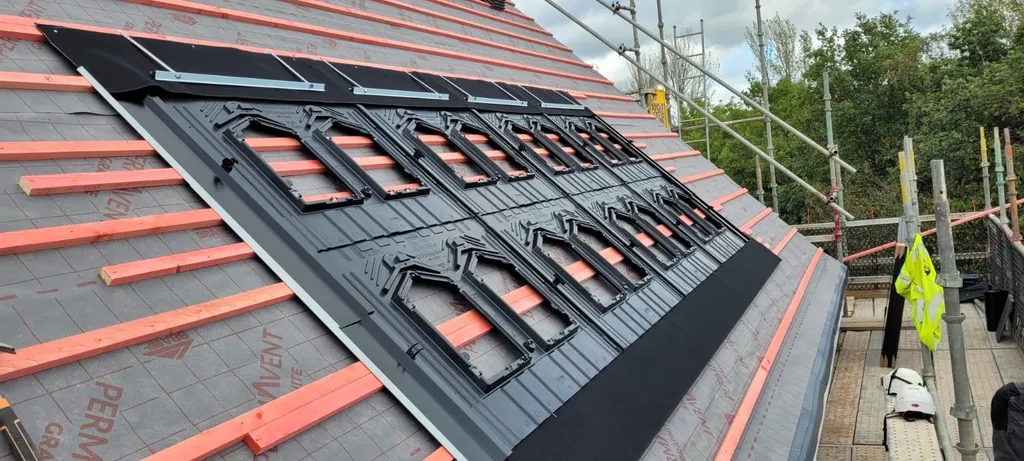 In-roof solar panel mounting trays — installation in progress, Manchester