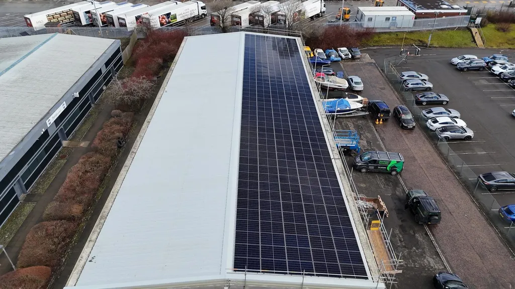 Industrial unit solar panels — flat roof, silver framed, Manchester