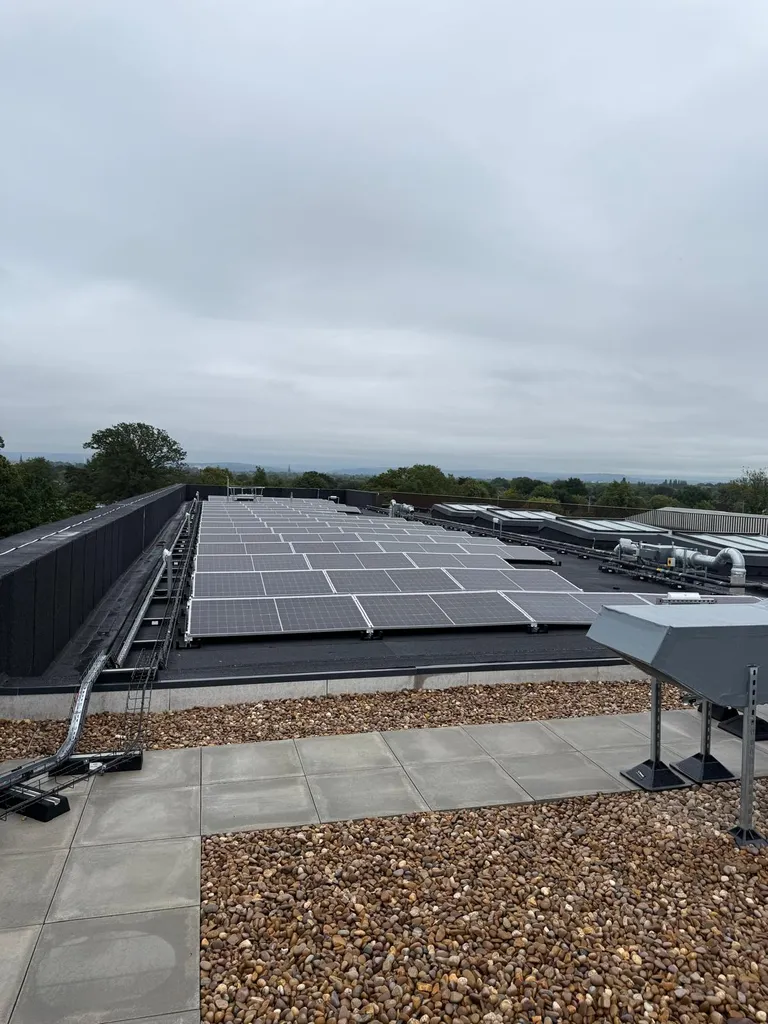 Large flat roof commercial solar panels — silver framed, Manchester