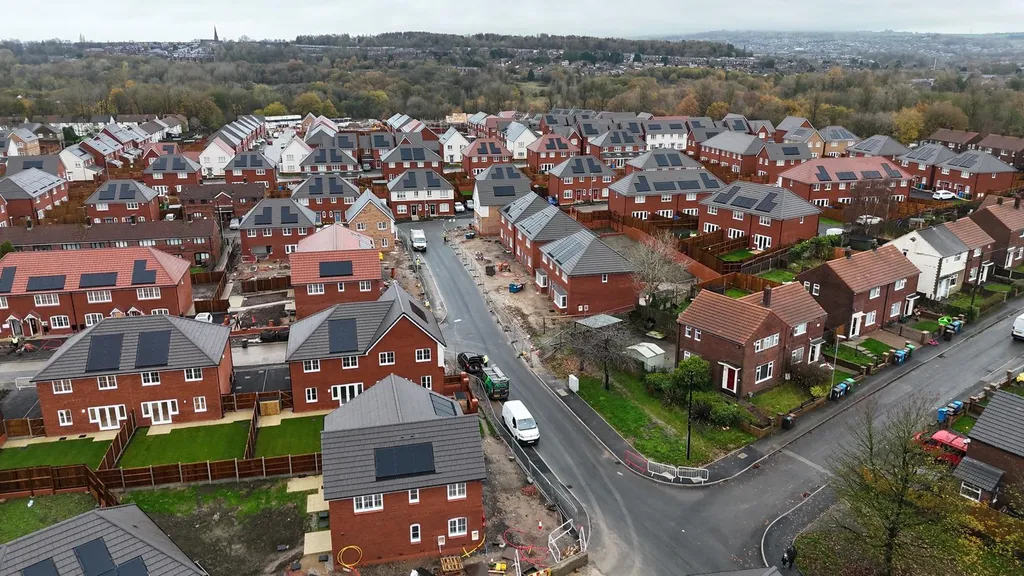 Manchester new-build estate — old and new housing contrast