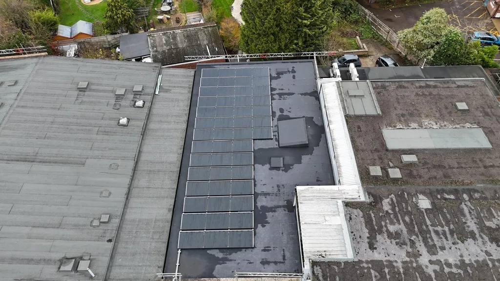 Manchester Renewables commercial solar on small flat roof building