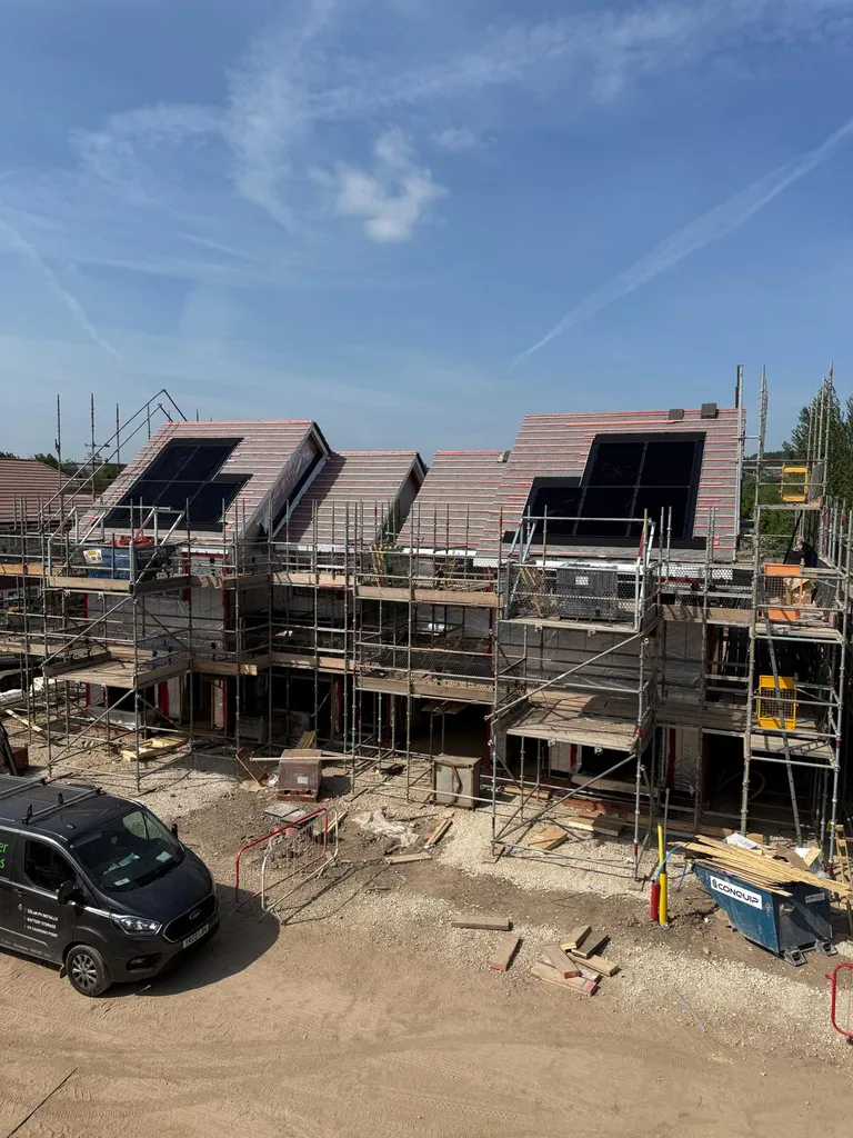 Manchester Renewables van at new-build solar installation — sunny day