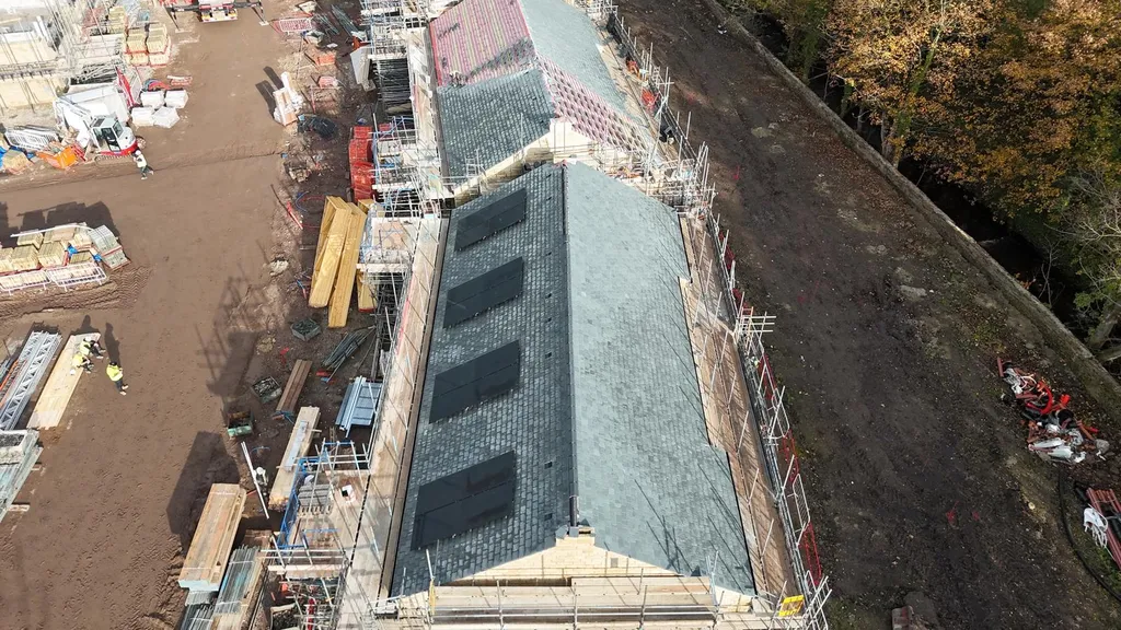 New-build apartment block with solar panels under construction, Manchester