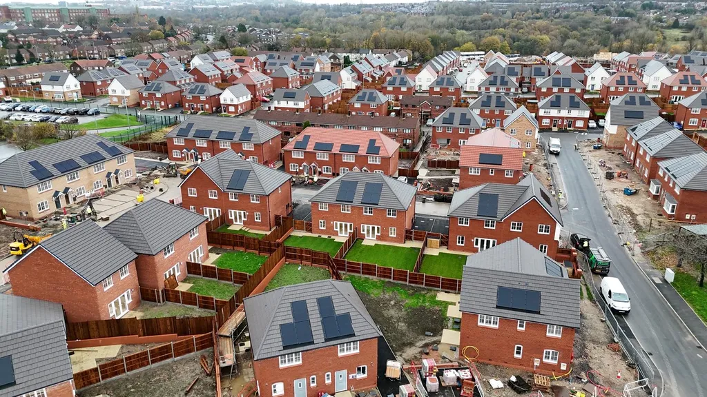 New-build homes with solar panels — completed gardens drone, Manchester