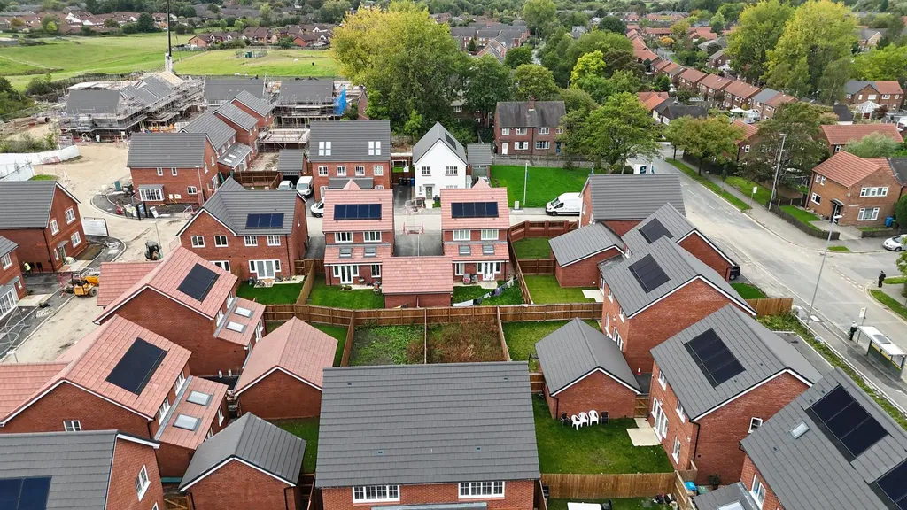 New-build solar panels — rear gardens drone view, Manchester