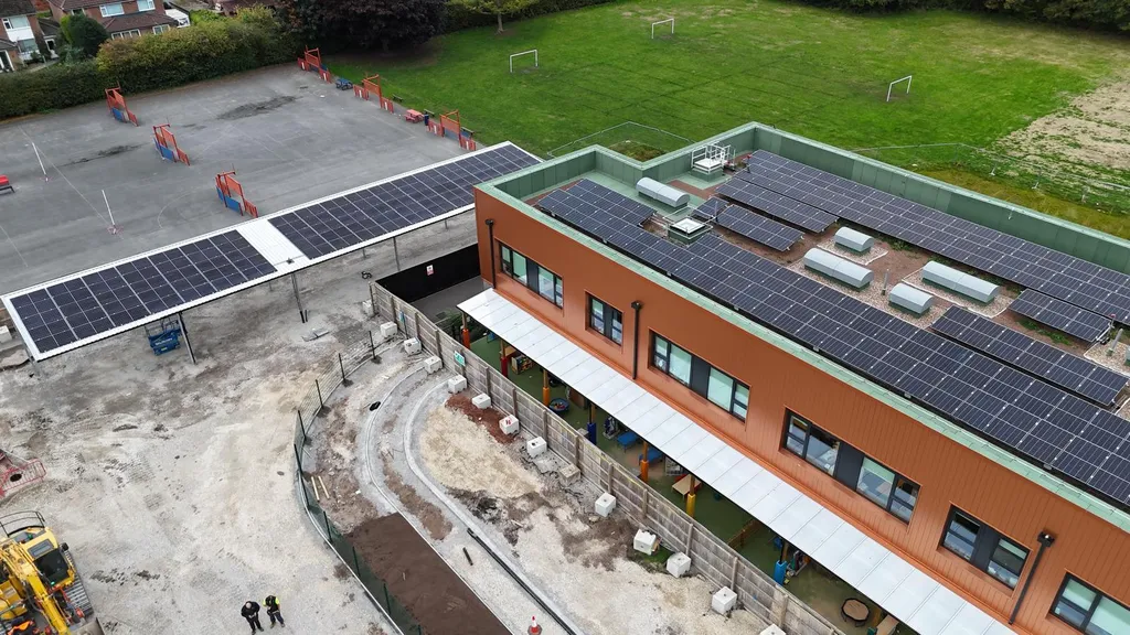 School solar canopy and rooftop panels — Manchester Renewables aerial