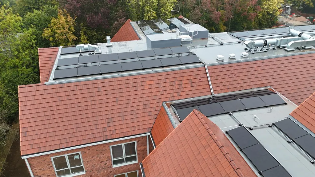 Solar panel installation on care home — red tile roof, Manchester