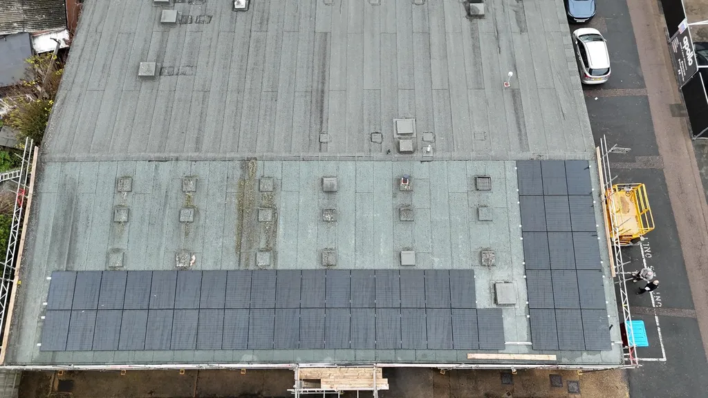 Solar panel installation on community hall — overhead, Manchester