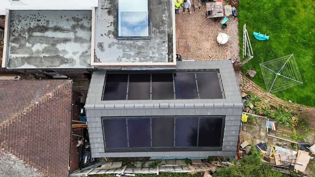 Solar panels on home extension roof — aerial multi-angle, Manchester