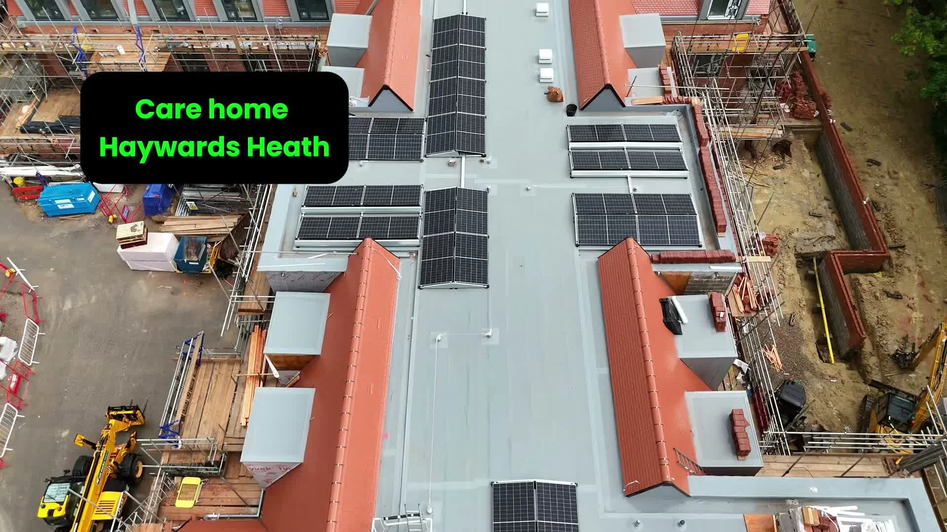 Aerial drone overview of the Haywards Heath care home commercial solar installation, with on-screen label reading 'Care home Haywards Heath'.