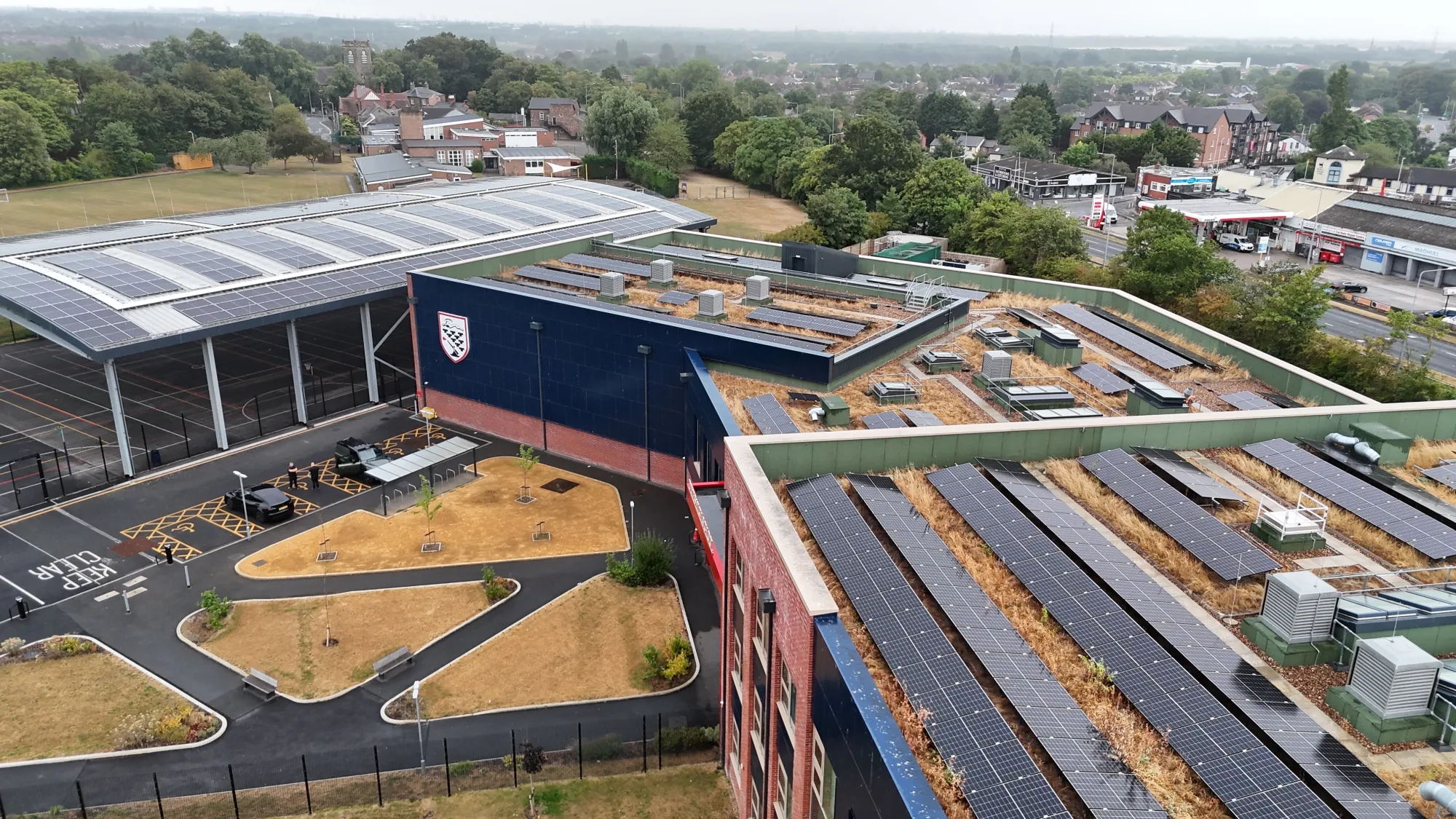 Aerial view of the 600kW solar installation across the roofs and canopies at Deyes High School, Liverpool
