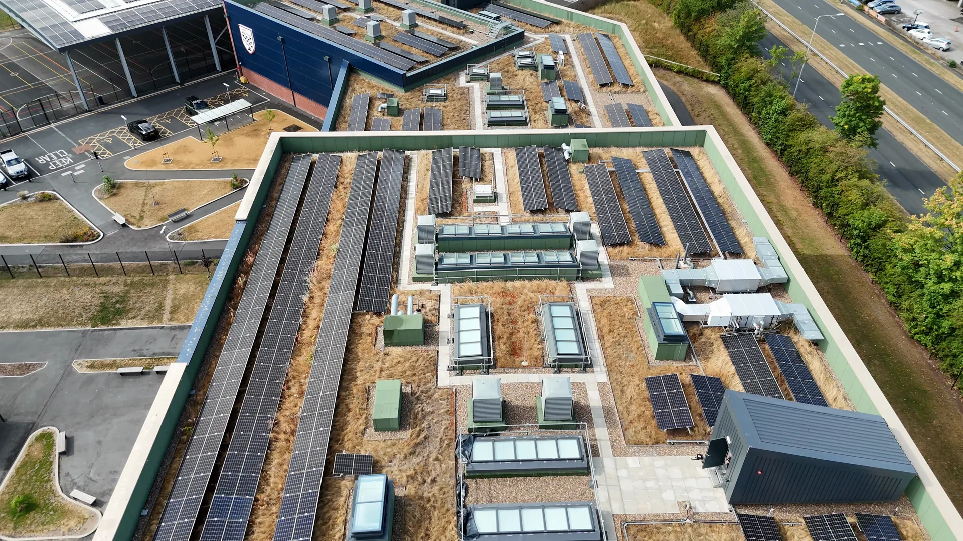 Aerial drone footage of the rooftop solar panels at Deyes High School, Liverpool