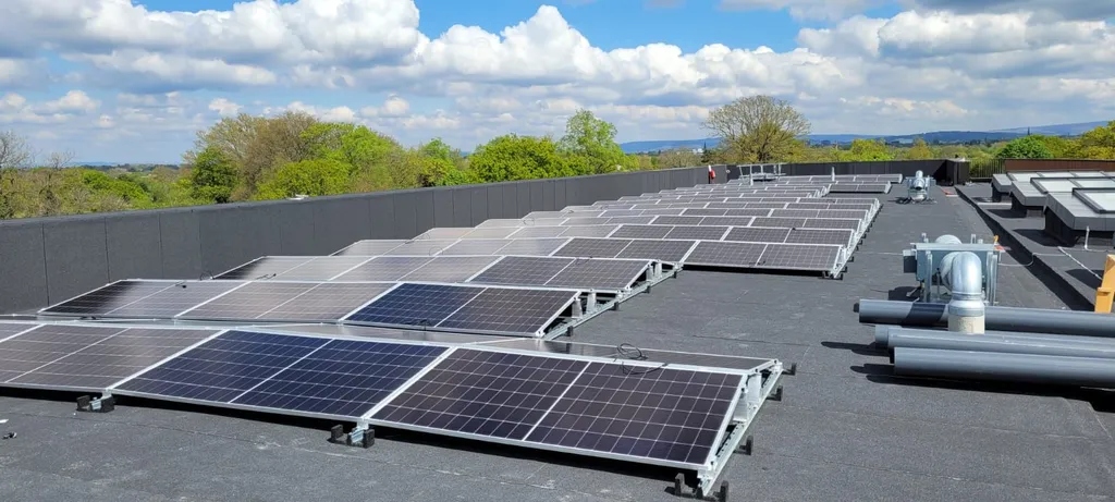 80kW solar PV system on college building — overhead view by Manchester Renewables
