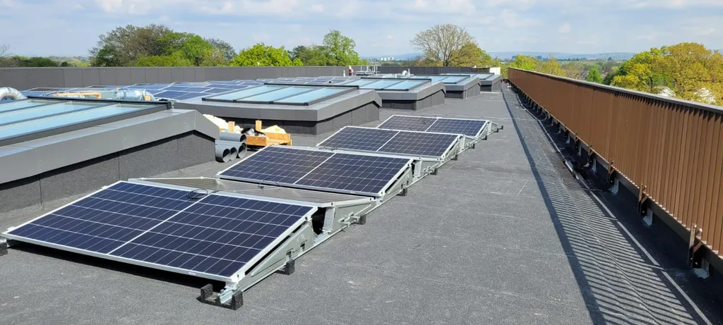 College rooftop solar installation — close-up of flat roof mounted panels