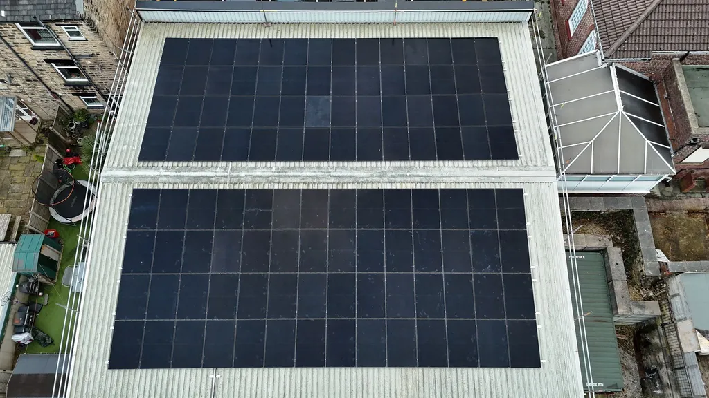 Completed 50kW factory solar installation — close-up of panel rows on flat roof