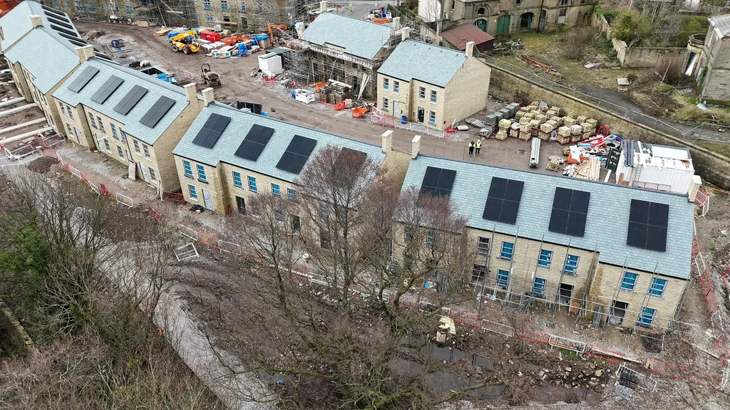 In-roof solar panels on new-build homes in Glossop — close-up aerial view