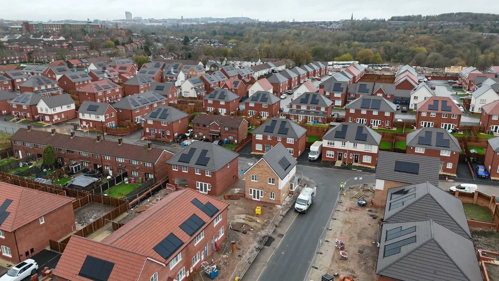 Completed new-build homes with solar panels in Oldham — aerial view by Manchester Renewables