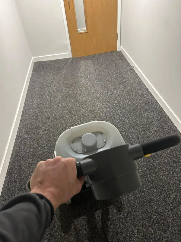 Office corridor carpet cleaning with rotary equipment