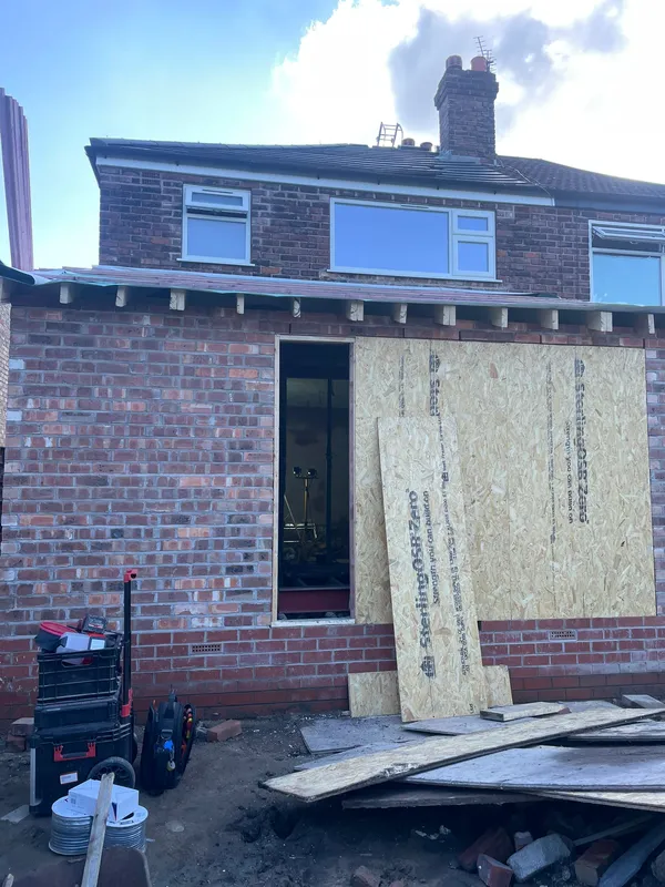 Rear extension under construction in Heaton Mersey, Stockport — exterior view from the garden, ready for first-fix electrical install