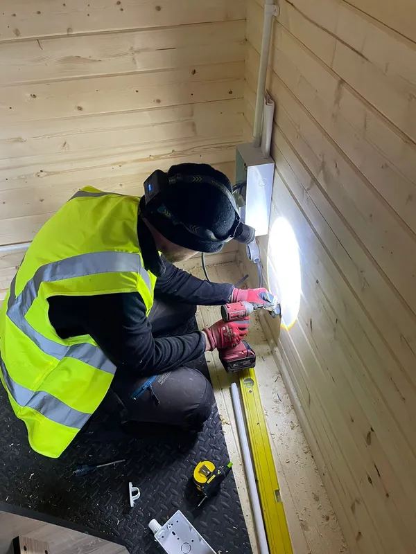 Conduit system feeding a sub-board inside a Sale garden office build