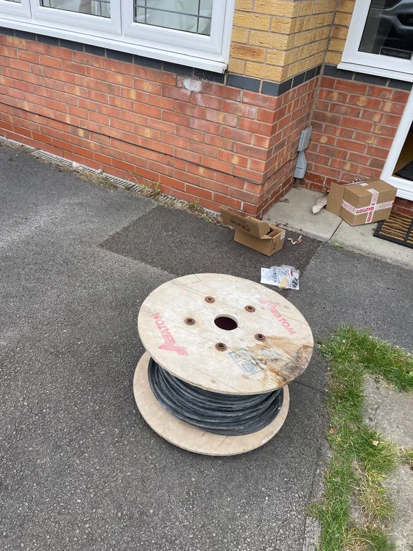 Reel of 6mm SWA cable on site at a Stalybridge home EV charger installation by Steels Electrical
