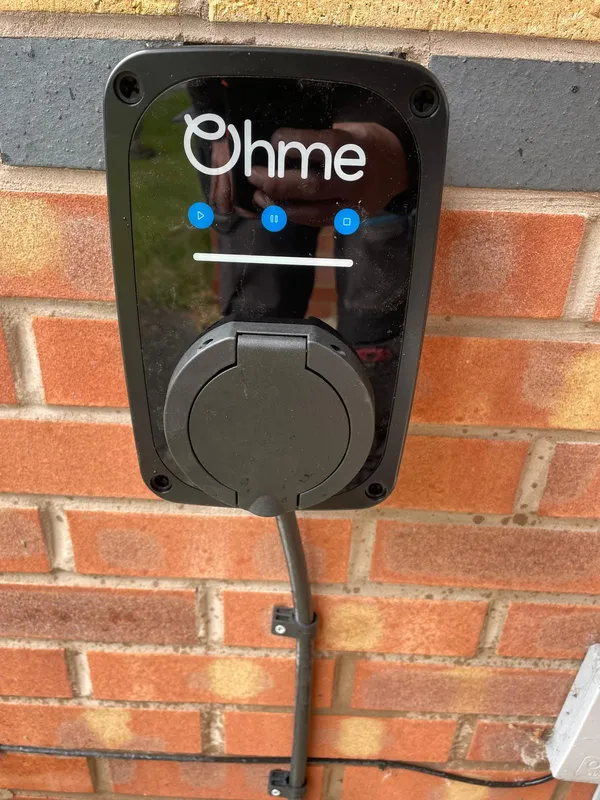 OHME e-pod 7kW EV charger installed on a brick wall in Stalybridge — Steels Electrical