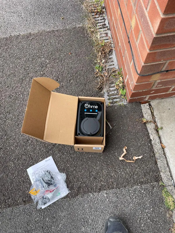 OHME e-pod 7kW EV charger unboxed and ready for installation on a Stalybridge driveway
