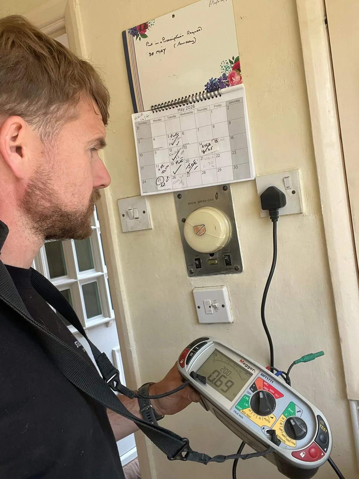 Steels Electrical engineer testing the new consumer unit in Hattersley with a Megger multifunction tester before certifying the installation