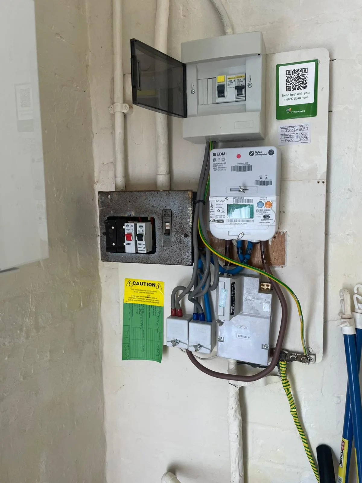 The original 1960s metal-clad fuse box and switchfuse in a Hattersley home before the consumer unit upgrade — no RCD or surge protection