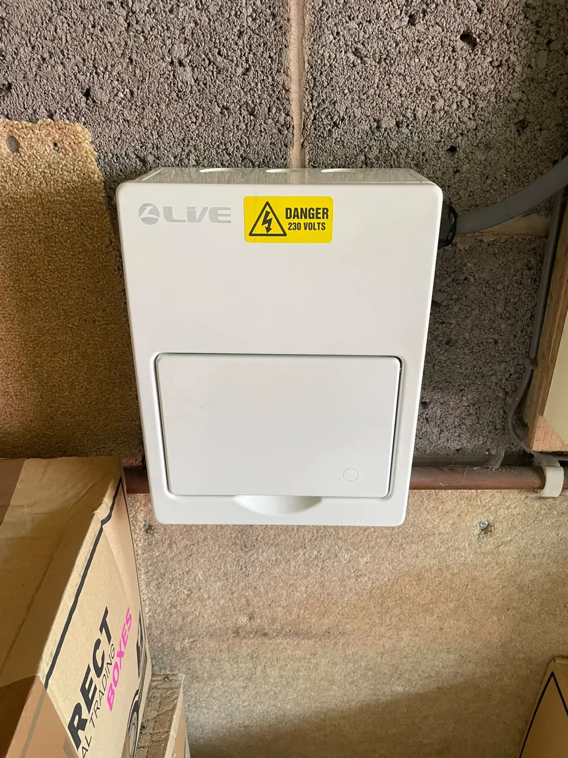 New sub-board enclosure installed in the garage by Steels Electrical to feed a dedicated air conditioning circuit in Glossop